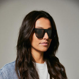Female model wearing black polarised sunglasses from Ozeano Vision