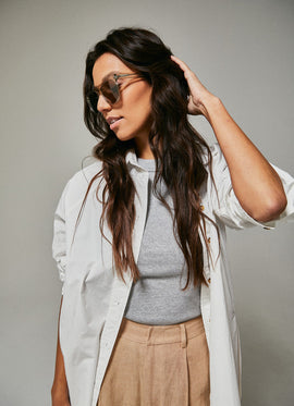 Female model wearing green polarised sunglasses from Ozeano Vision