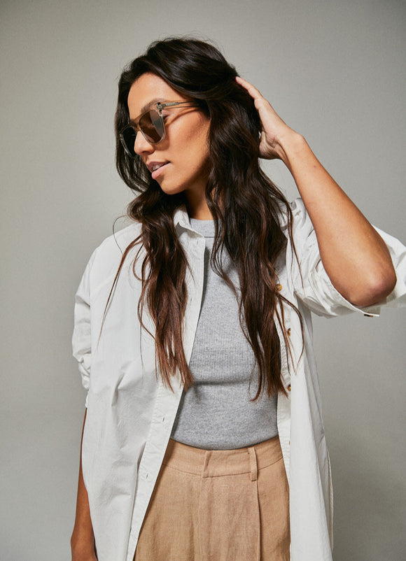 Female model wearing green polarised sunglasses from Ozeano Vision