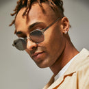 Male model wearing green polarised sunglasses from Ozeano Vision