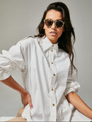 Female model wearing black and white polarised sunglasses